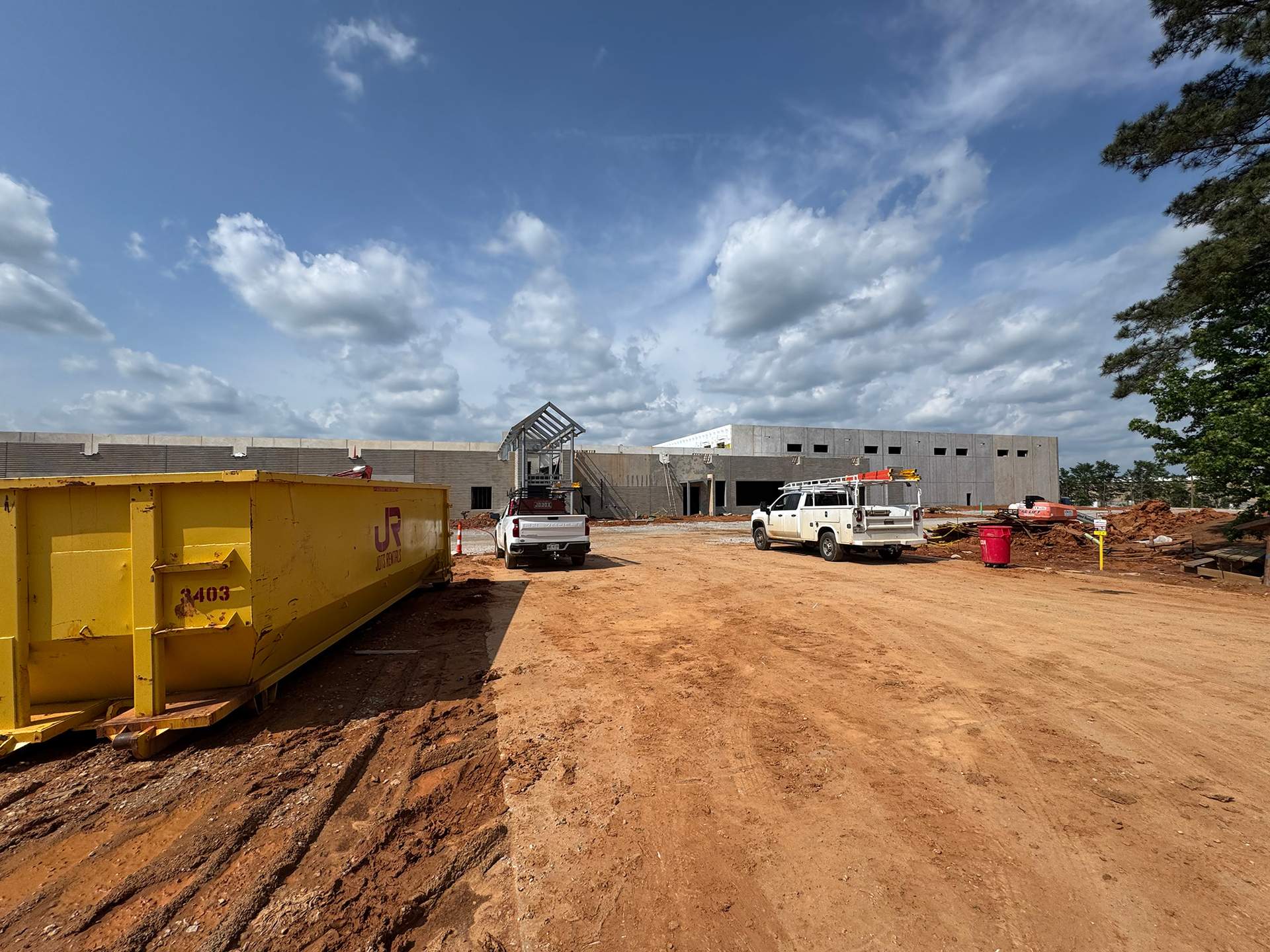 30-yard JOTS roll-off dumpster on a commercial construction site